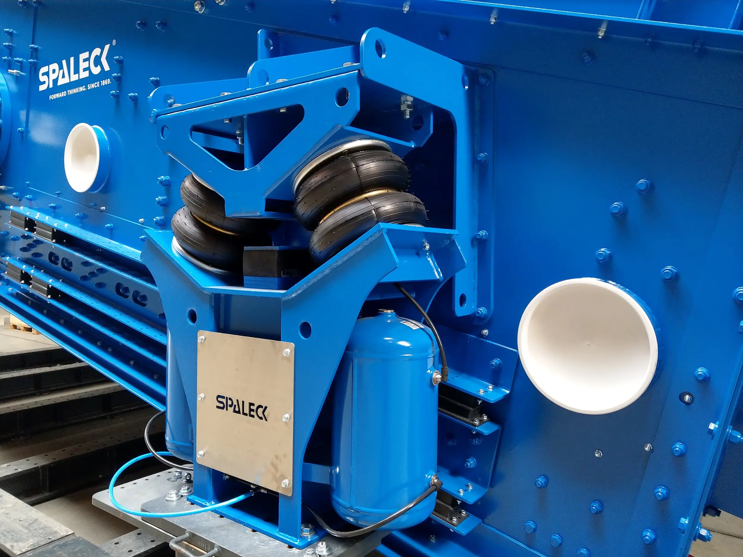 Blauw machineonderdeel van SPALECK met luchtvering.